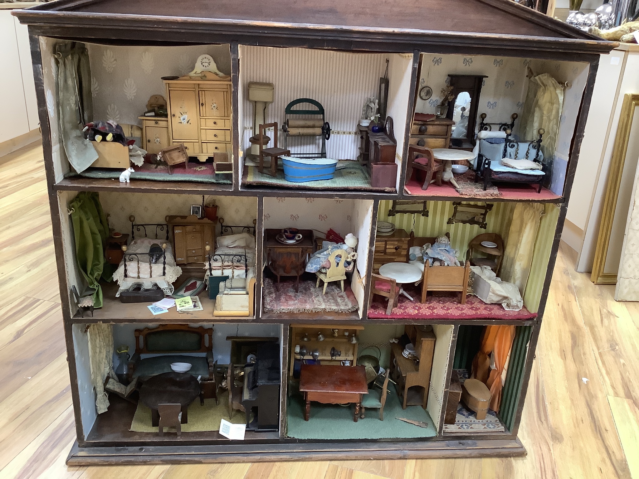 A furnished English dolls’ house, circa 1810-20, 104cm high